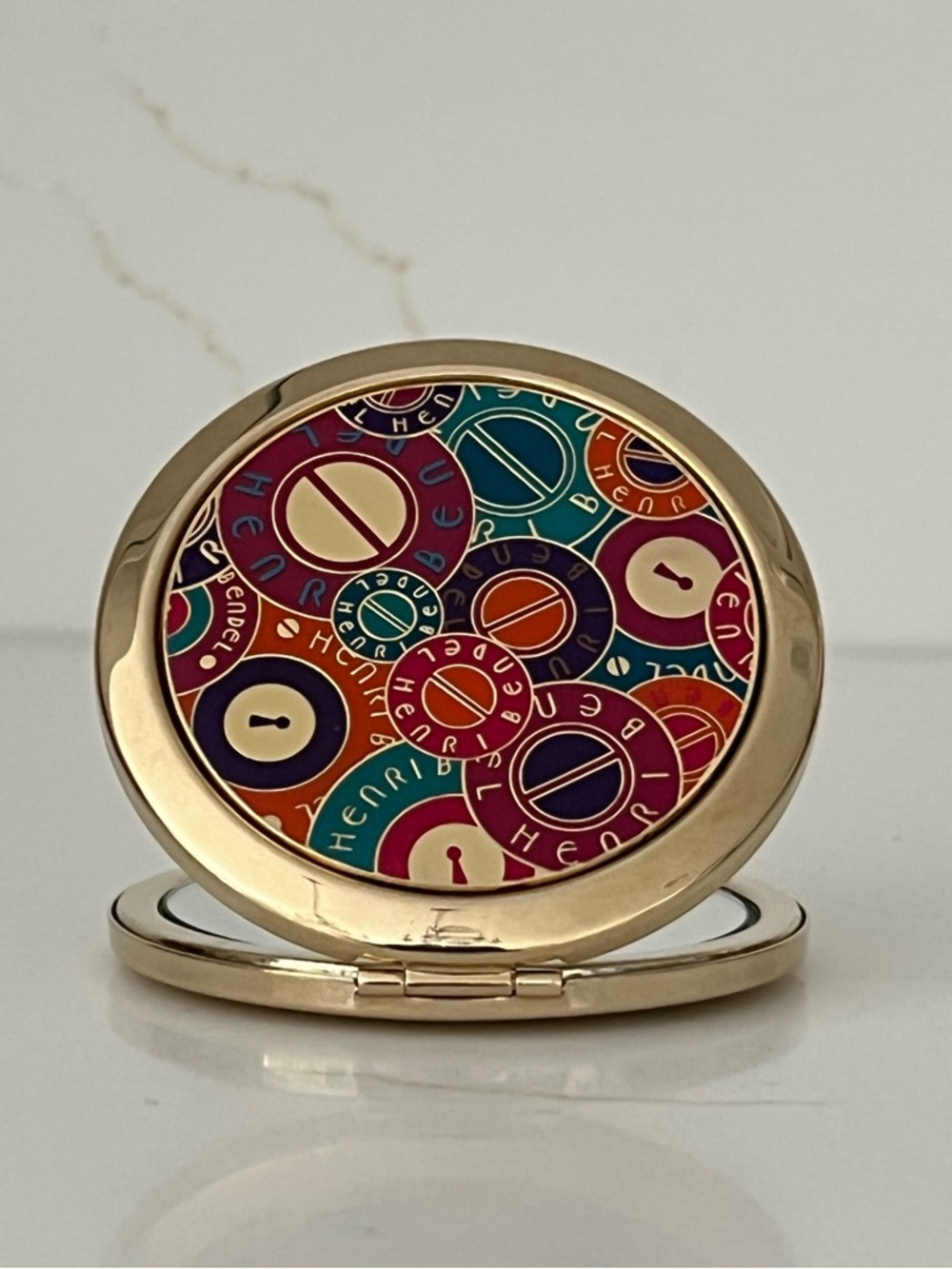 NWOT Henri Bendel Gold Compact Mirror with Multicolor Enamel Design